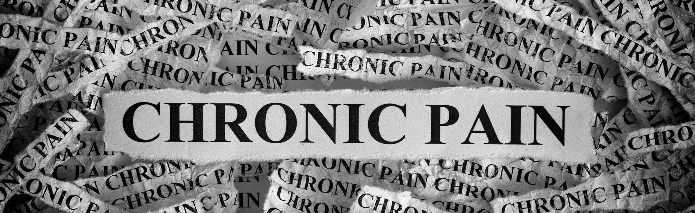 Black-and-white collage of torn paper strips repeatedly printed with the words “CHRONIC PAIN,” with a central bold strip highlighting the same text, representing ongoing pain awareness and health condition education.
