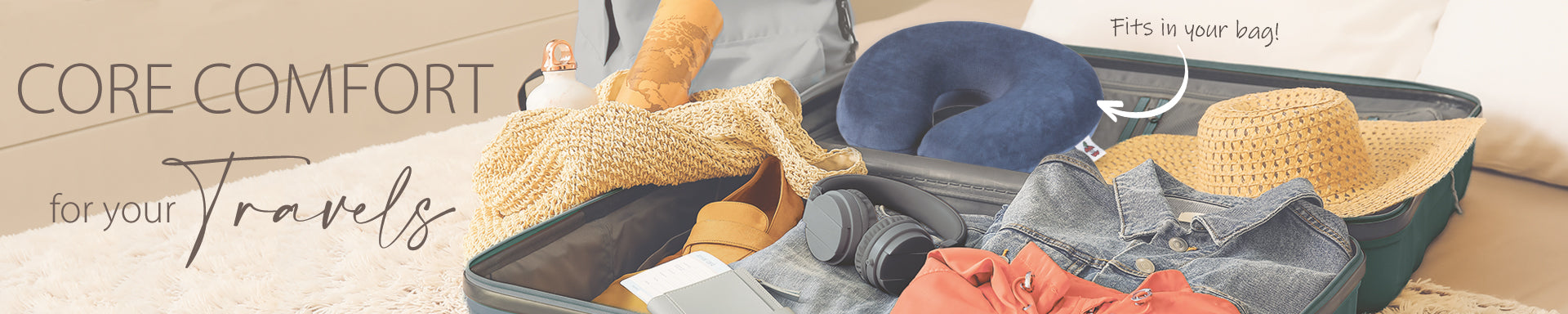 Core Products Core Comfort travel collection banner featuring travel pillows, blankets, and comfort accessories arranged on a table; visible text reads “CORE COMFORT for your travels,” highlighting portable support and comfort for travel and relaxation.