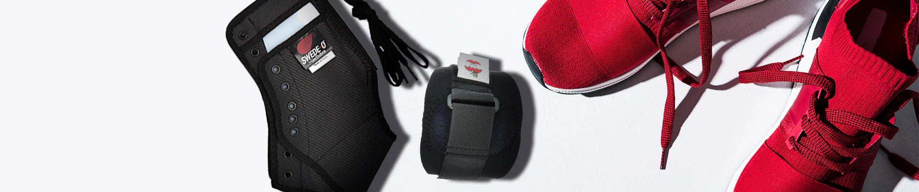 Swede-O ankle brace and Swede-O tennis elbow brace displayed next to red tennis shoes on a neutral background; no visible text, highlighting support, stability, and injury prevention for active lifestyles.