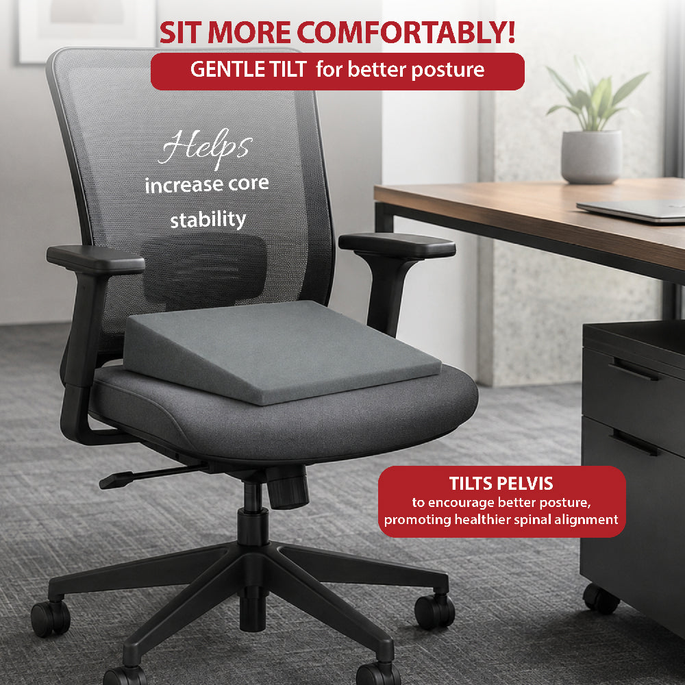 Core Products Stress Wedge seat cushion shown on an office chair. Visible text highlights: “Sit More Comfortably! Gentle Tilt for better posture,” “Helps increase core stability,” and “Tilts pelvis to encourage better posture, promoting healthier spinal alignment.” The gray wedge-shaped cushion provides angled seating support for improved posture and sitting comfort.