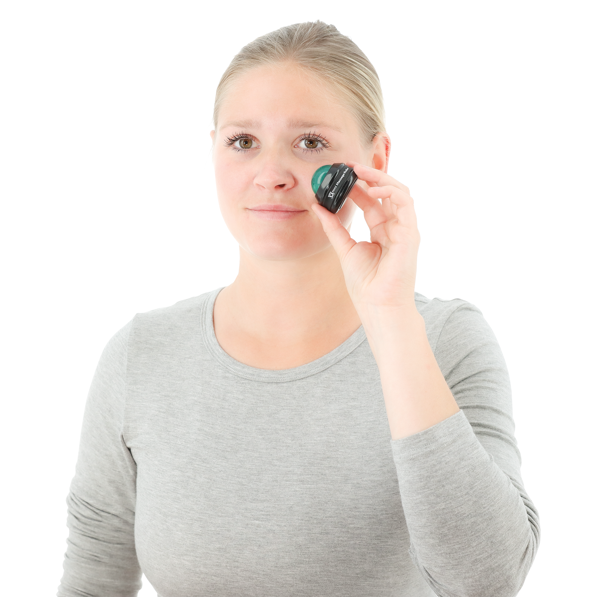 Woman using a Core Products International Omni Massage Roller on her cheek, holding the green marbled massage ball in a black base labeled “Omni Massage Roller.” She wears a light gray long-sleeve shirt. The handheld therapy tool is shown in use for targeted muscle relief and facial massage to help ease tension and promote circulation.