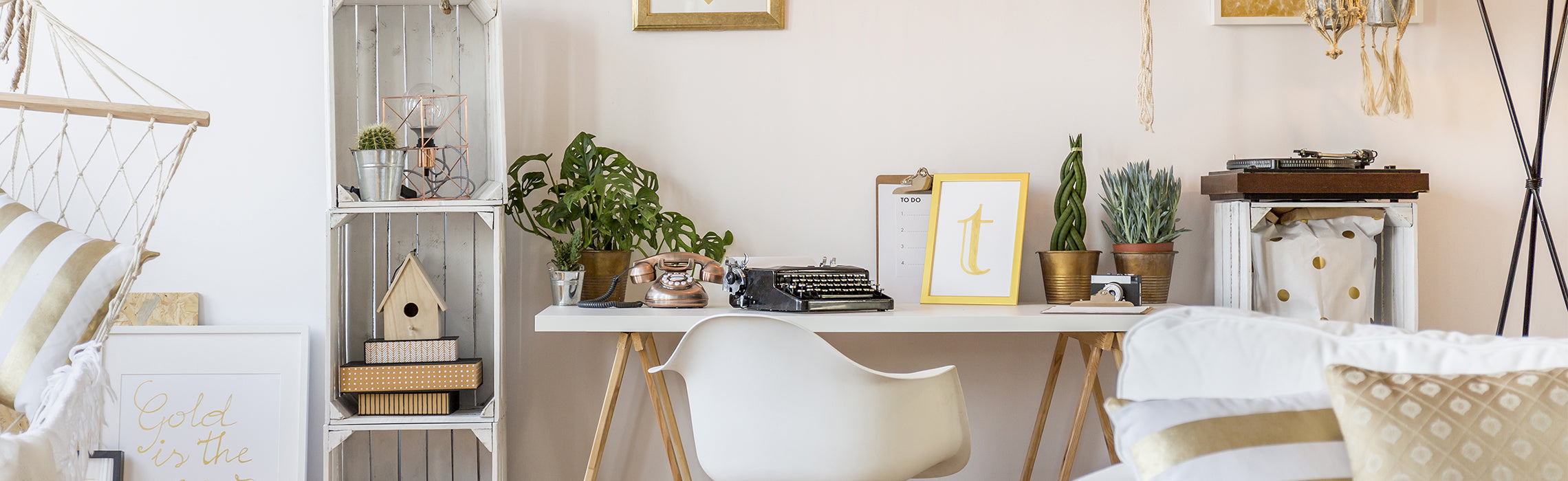 Alt text: Bright, organized home office workspace featuring a wooden desk, white chair, indoor plants, decorative accents, and natural lighting.