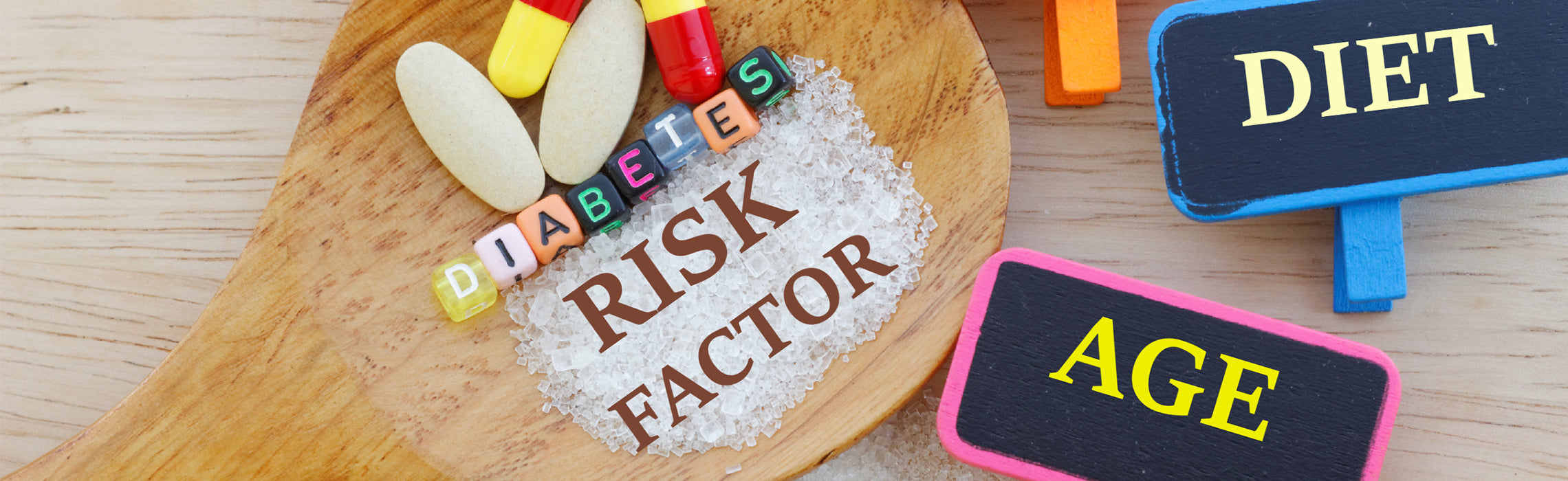Wooden spoon filled with sugar crystals labeled “RISK FACTOR,” surrounded by pills and letter tiles spelling “DIABETES,” with signs reading “DIET” and “AGE,” representing diabetes risk factors, nutrition, and health awareness.
