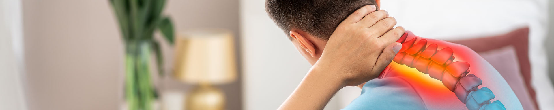 Close-up of a person gripping the back of the neck with a red-highlighted spine graphic indicating neck pain; blurred indoor background with lamp and plant. No visible text.