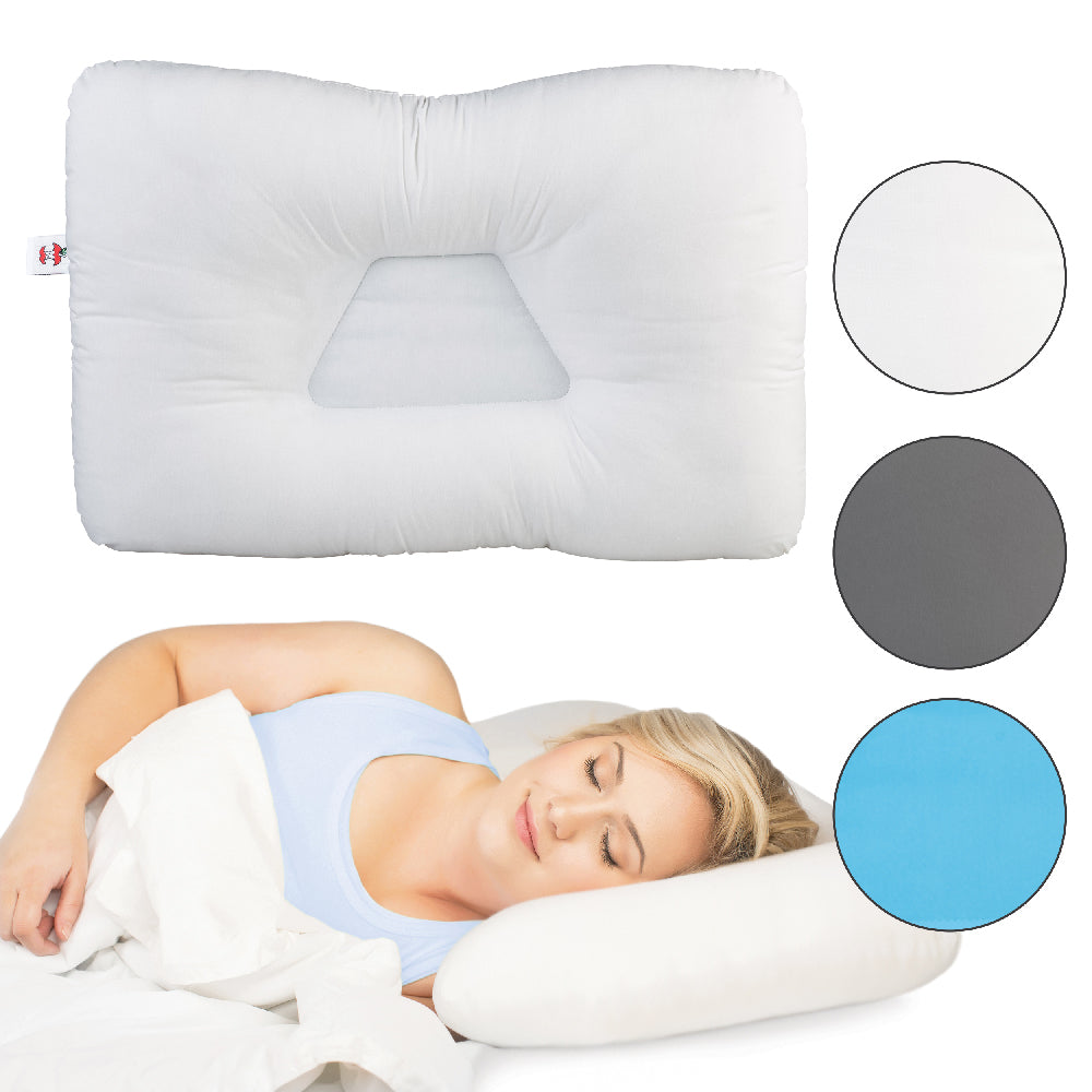 White ergonomic pillow with a recessed center and raised side supports, shown alone and in use by a person lying on their side to demonstrate proper head and neck alignment. The design highlights contoured shaping for comfort and posture support. No visible text, brand name, or product name appears on the pillow.