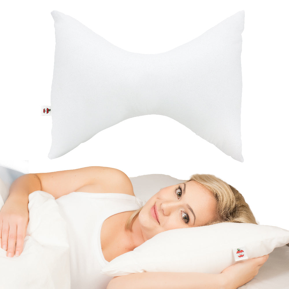White Bowtie neck support pillow with an ergonomic hourglass shape shown alone and in use by a woman resting comfortably on her side. Contoured design helps support the head, neck, and shoulders for improved spinal alignment, reduced neck pain, and enhanced sleeping comfort. Soft supportive pillow is designed for side and back sleepers seeking ergonomic sleep support and pressure relief.