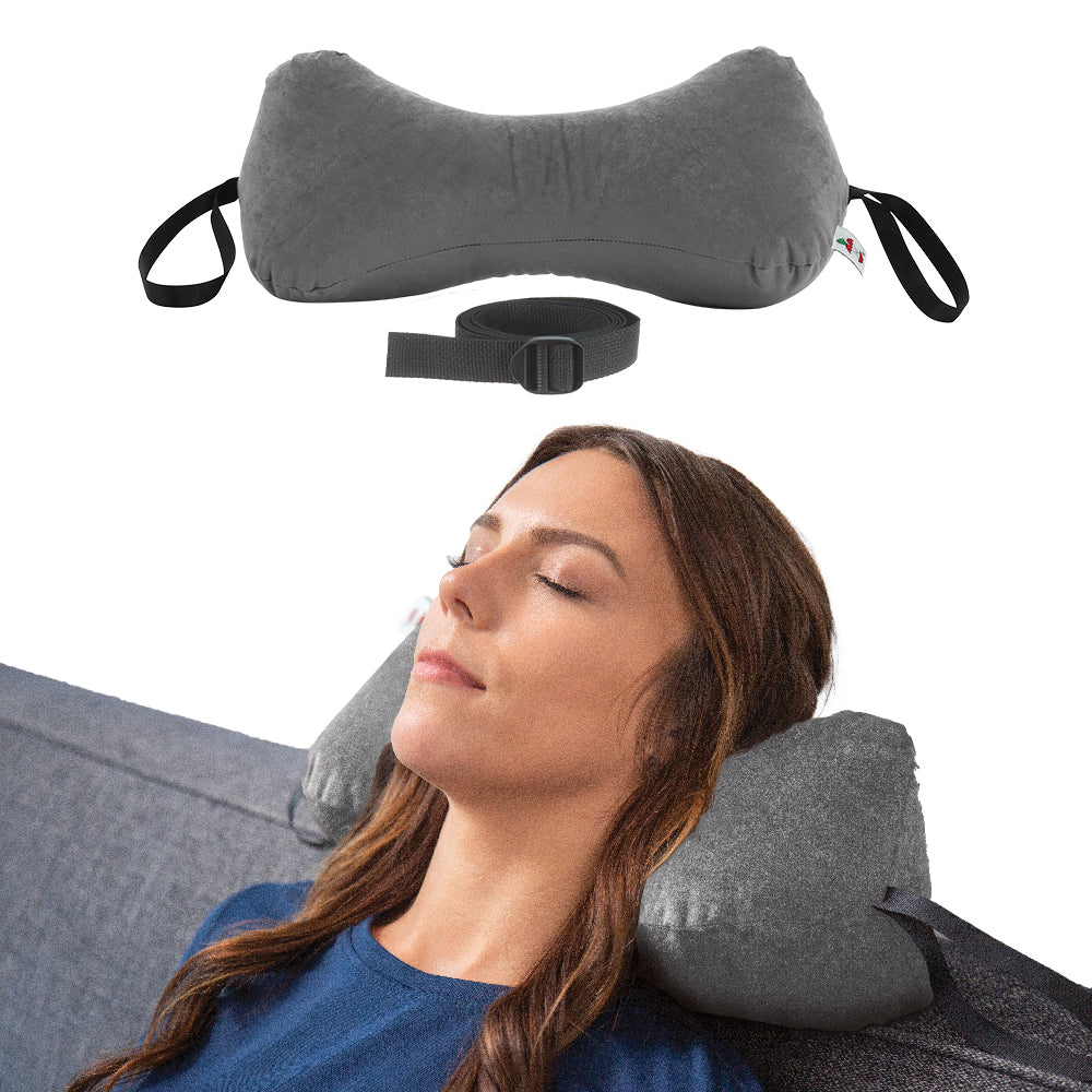 Sleep Log™ Bone Shaped Pillow in gray shown with adjustable strap and side handles for secure placement. Designed with soft fiber fill for customizable comfort, it supports the neck in a relaxed seated position, helping maintain proper alignment while resting or lounging.